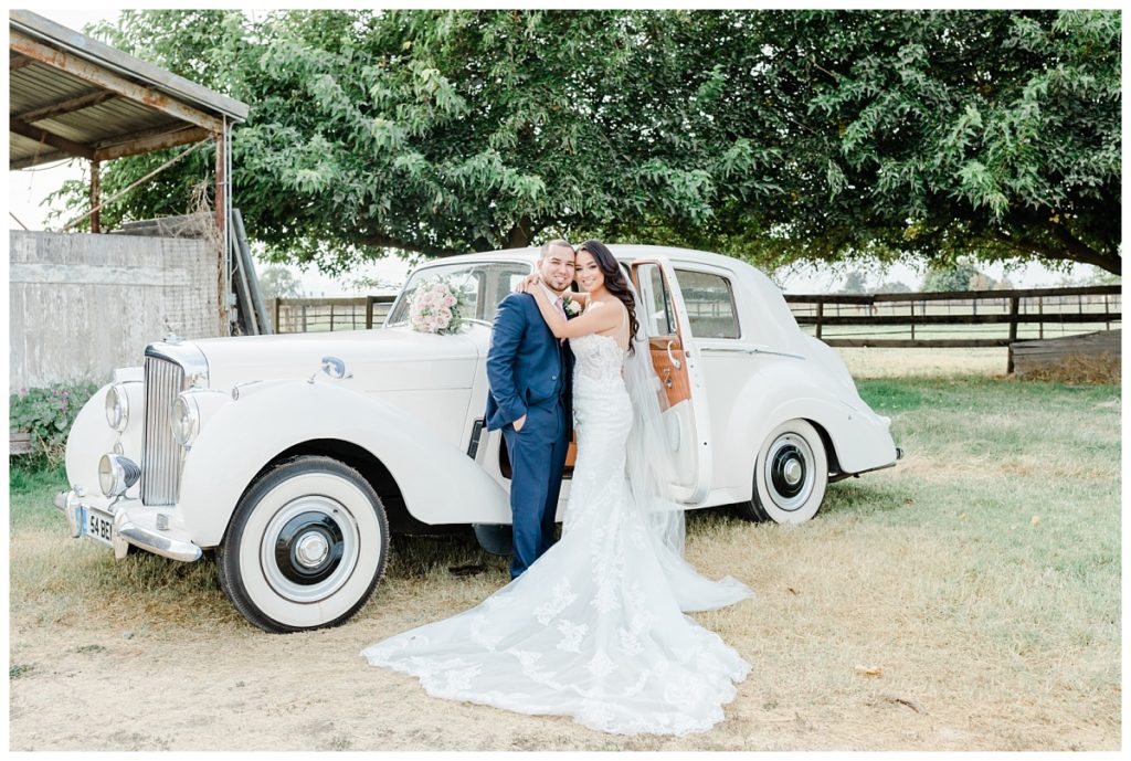 Bride and Groom with Vintage Car Photo