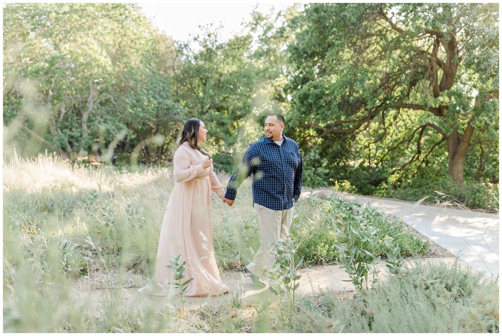 Engagement photos at UC Davis Arboretum Walking Pose
