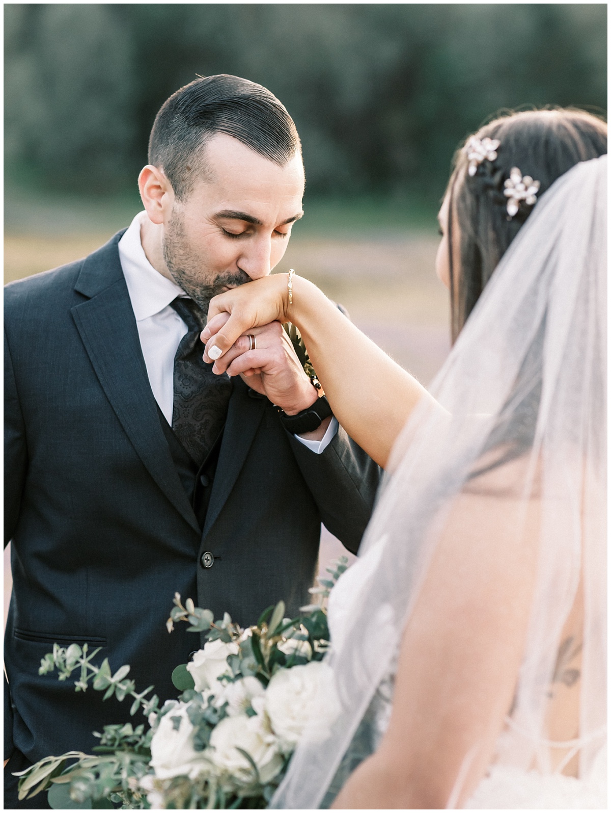Groom Kissing Bride Hands