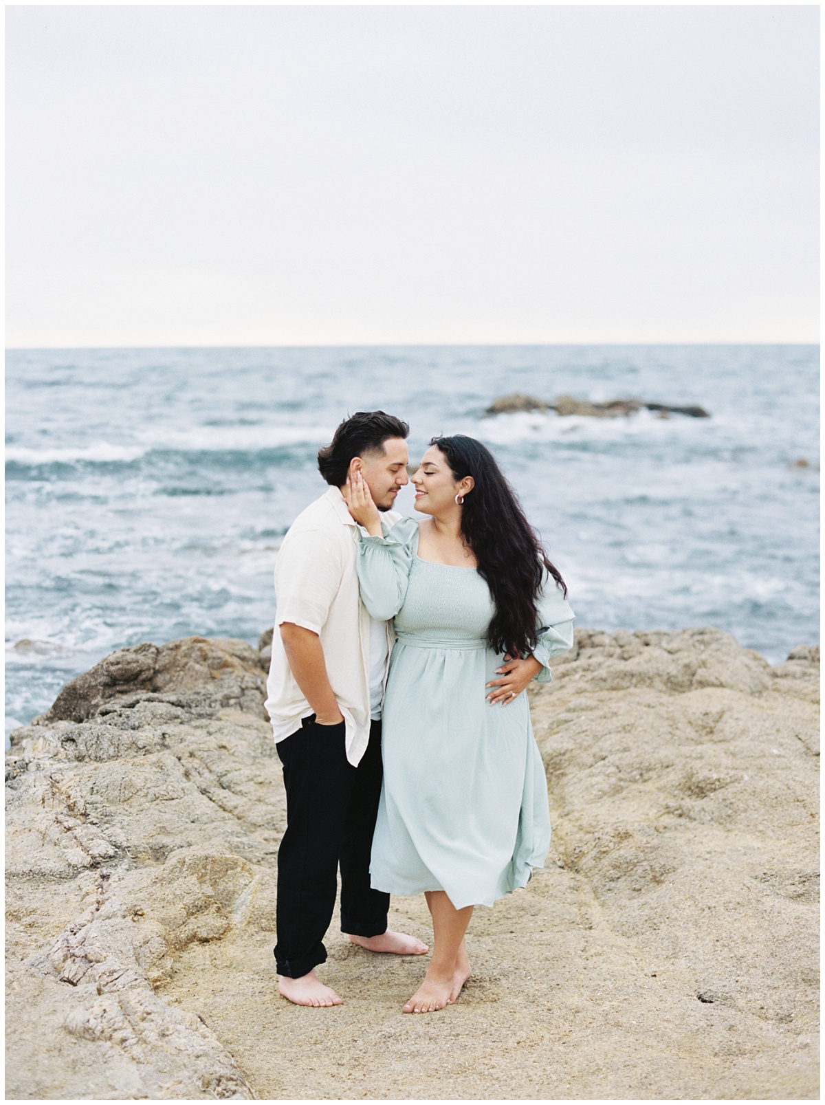 Couple at the Beach in Pacific Grove for their Engagement Session with Intimate posing