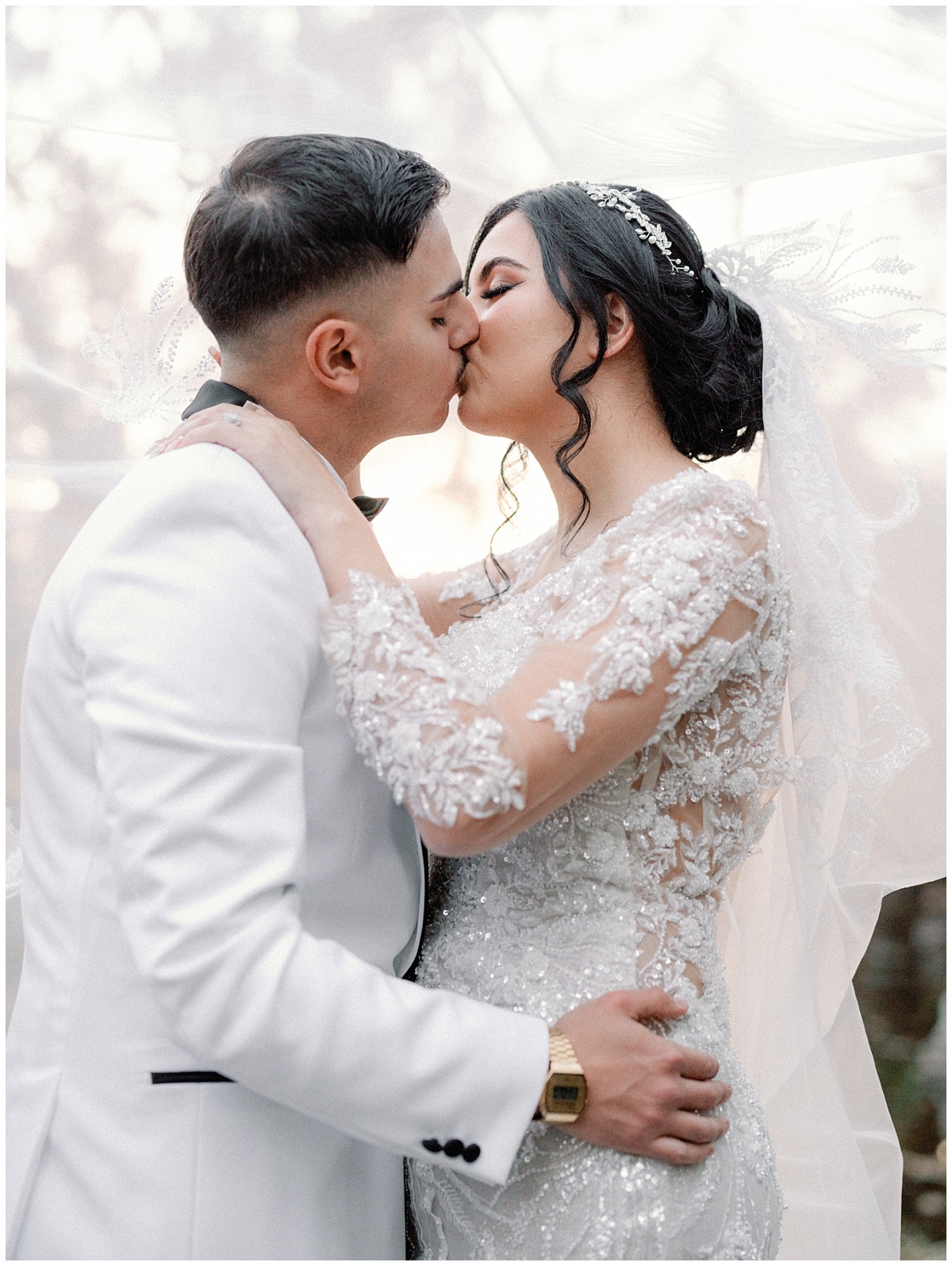 Under a Wedding Veil for an Intimate Kiss