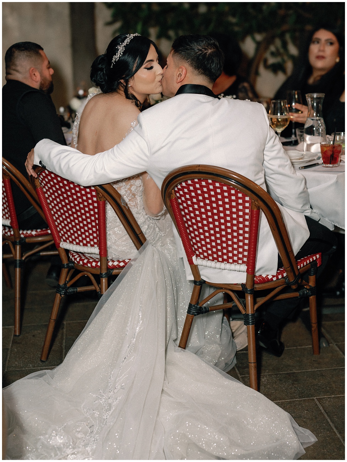 Reception Dinner Moment with Couple sharing a kiss